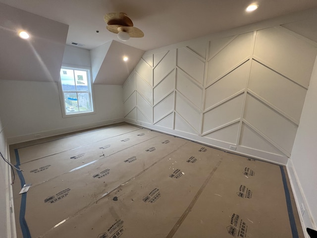 additional living space featuring vaulted ceiling