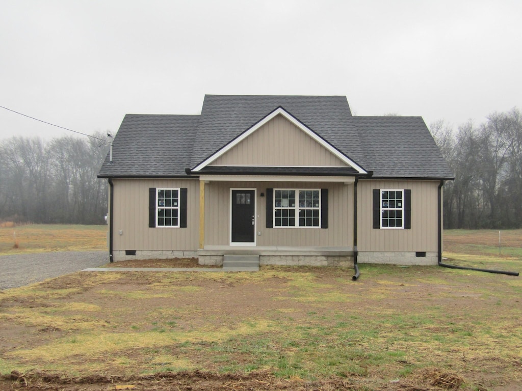 view of front of home with a front lawn and a porch