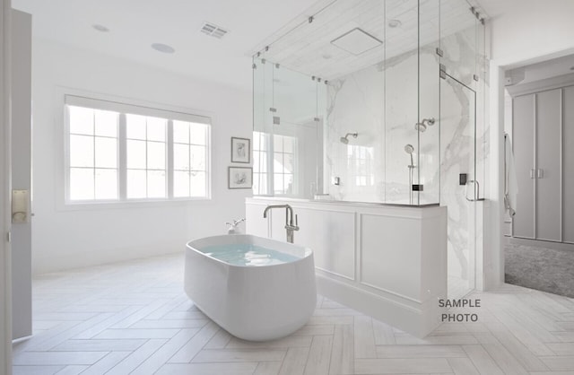 bathroom with shower with separate bathtub and parquet flooring