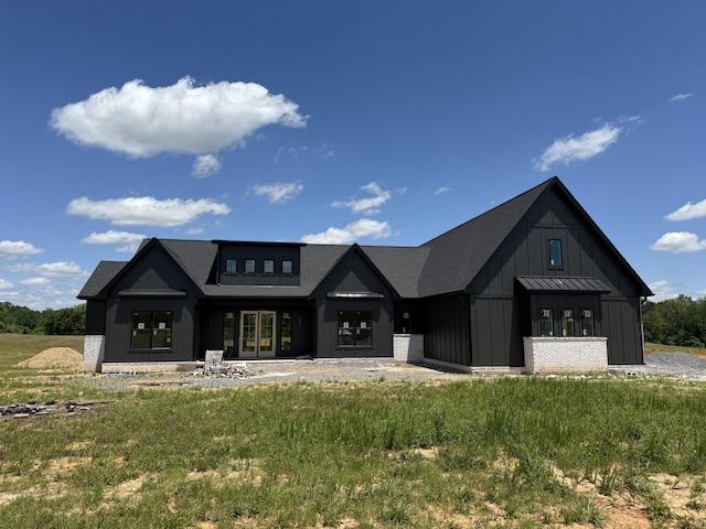 17 Solitude Way, Clarksville, TN 37043 - modern inspired farmhouse with board and batten siding, roof with shingles, and french doors