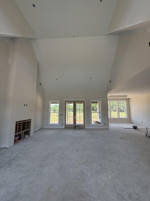 17 Solitude Way, Clarksville, TN 37043 - unfurnished living room with high vaulted ceiling, plenty of natural light, and carpet flooring