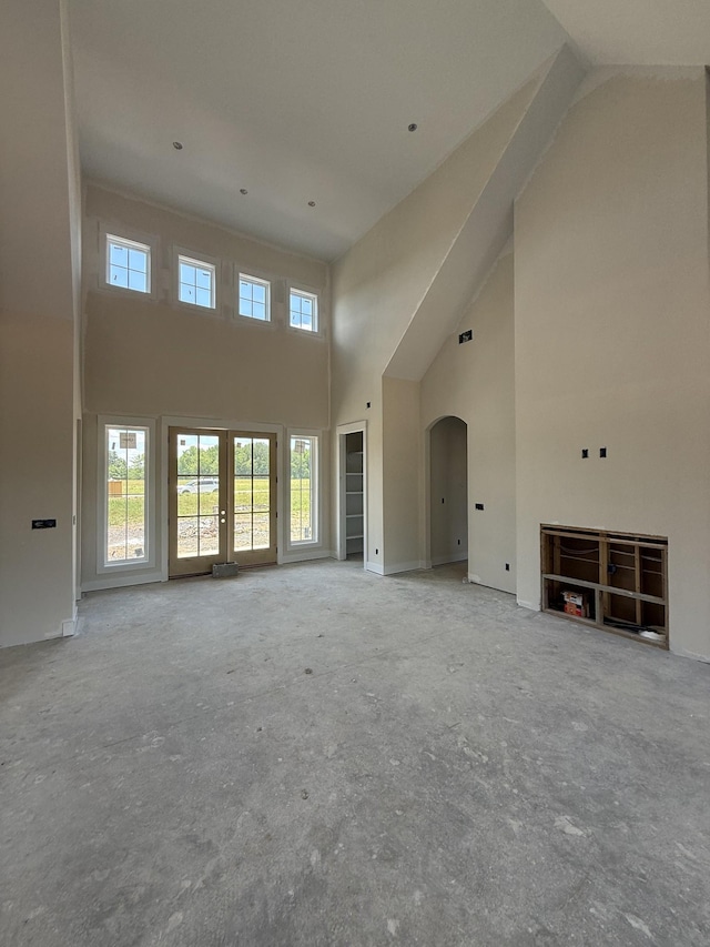17 Solitude Way, Clarksville, TN 37043 - unfurnished living room with a high ceiling and arched walkways