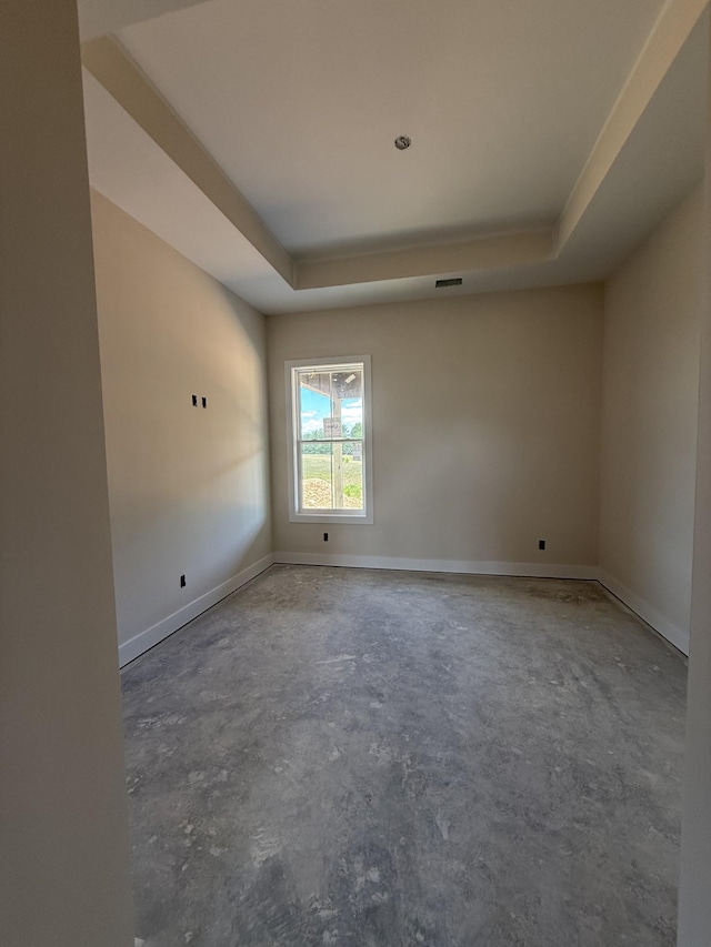 17 Solitude Way, Clarksville, TN 37043 - unfurnished room with a tray ceiling, concrete floors, and baseboards