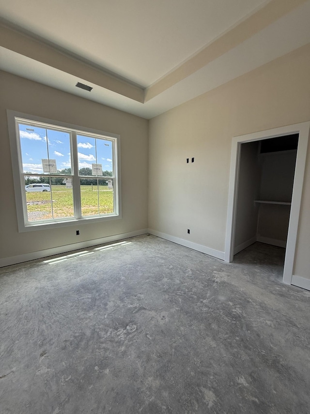 17 Solitude Way, Clarksville, TN 37043 - unfurnished bedroom featuring concrete floors, a tray ceiling, and baseboards