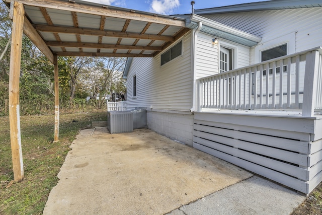 view of home's exterior featuring central AC, a patio area, and a deck