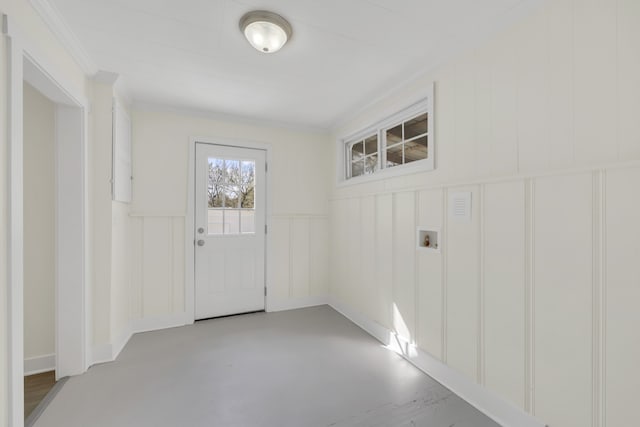 interior space with concrete floors and ornamental molding