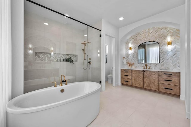 18 Solitude Way, Clarksville, TN 37043 - full bath featuring a soaking tub, a shower stall, and vanity