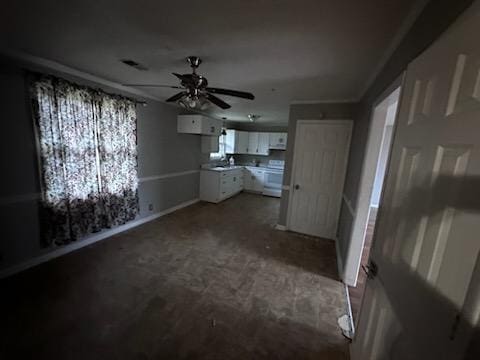 interior space with ceiling fan