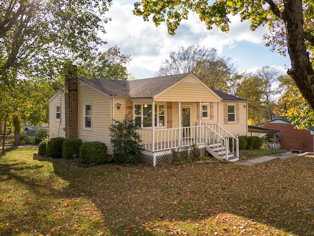 ranch-style home featuring a front yard