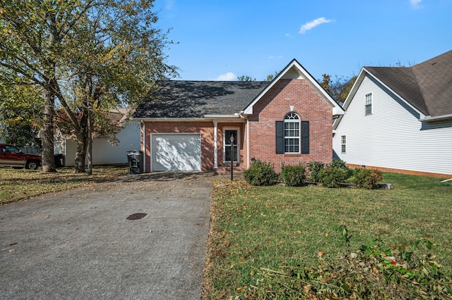 view of front of home featuring a garage and a front lawn