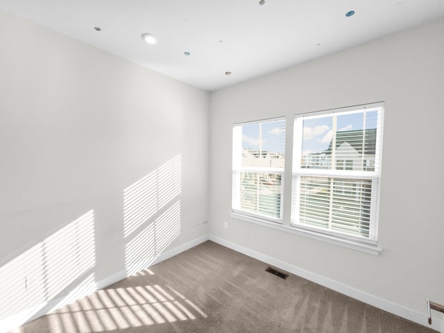 unfurnished room with carpet flooring