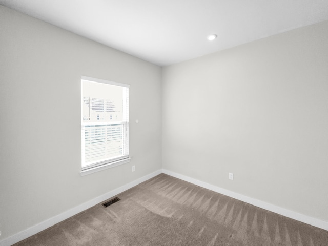 unfurnished room featuring carpet floors