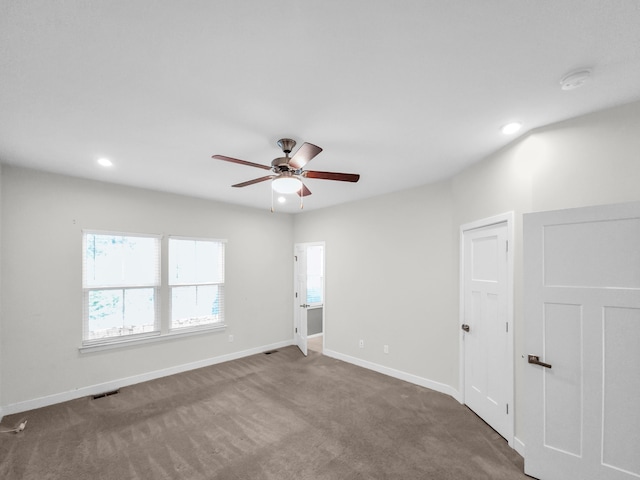 empty room featuring carpet and ceiling fan