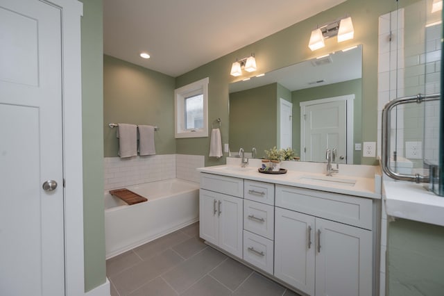 bathroom featuring a washtub, vanity, and decorative backsplash