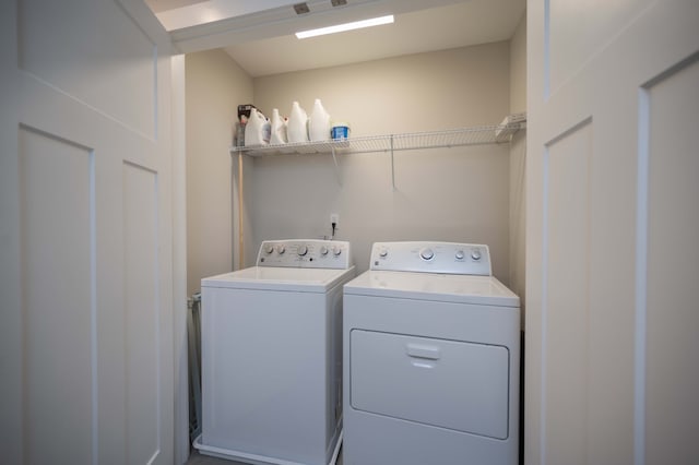 laundry room with separate washer and dryer