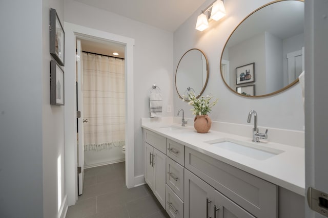 bathroom featuring a shower with curtain, tile patterned floors, vanity, and toilet