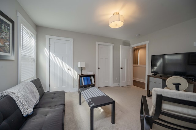 living room featuring light colored carpet