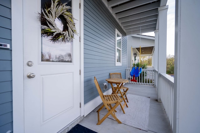 doorway to property featuring a porch