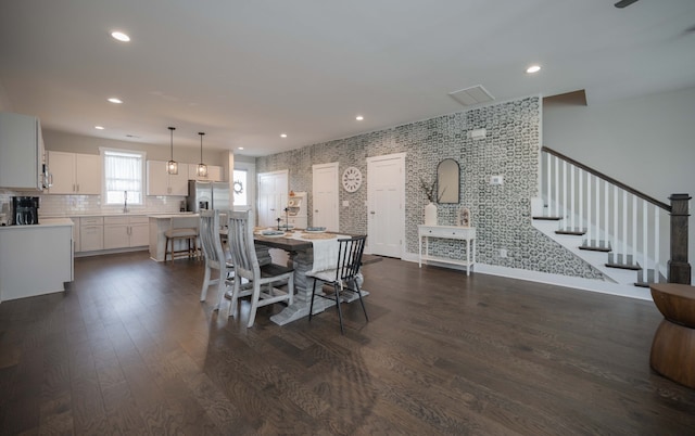 dining room featuring dark hardwood / wood-style floors and sink