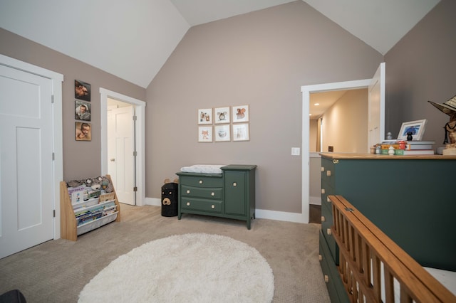 carpeted bedroom with vaulted ceiling