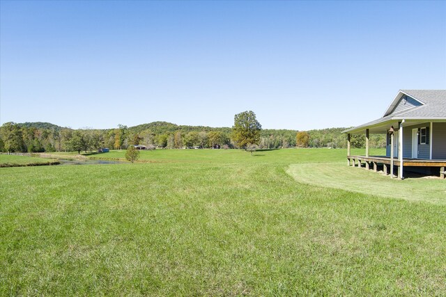 view of yard with a rural view