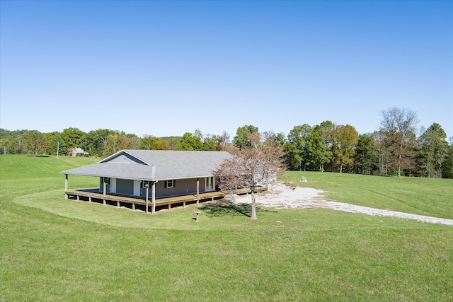 back of property featuring a lawn