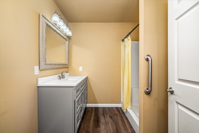 bathroom featuring a shower with curtain, wood-type flooring, and vanity