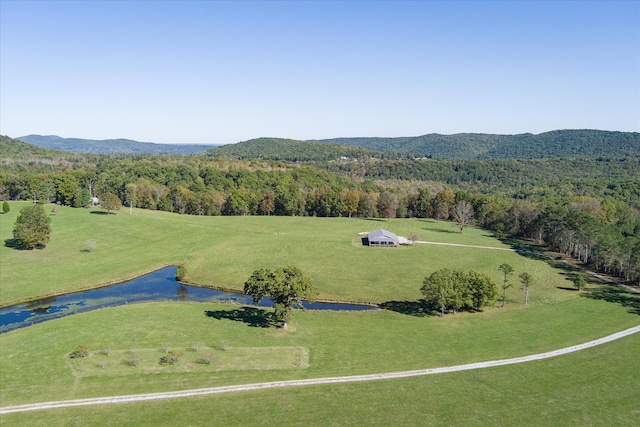 aerial view featuring a water and mountain view