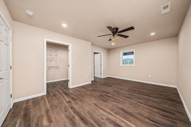 unfurnished bedroom with dark hardwood / wood-style flooring and ceiling fan