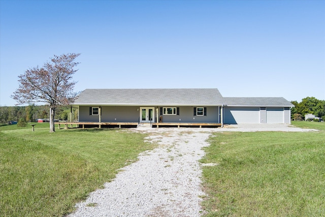 view of front of home featuring a garage and a front yard