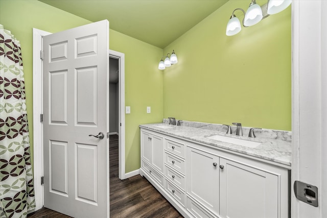 bathroom featuring hardwood / wood-style floors and vanity