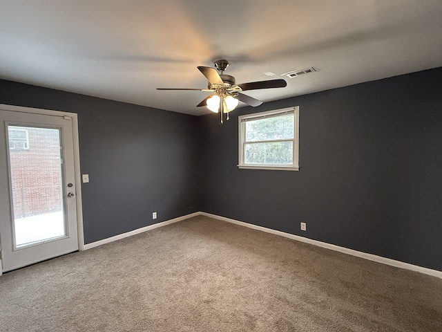 unfurnished room with carpet and ceiling fan