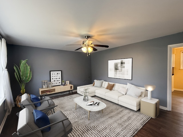 living room featuring dark hardwood / wood-style floors and ceiling fan