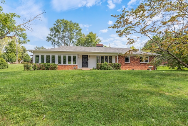 ranch-style home featuring a front yard