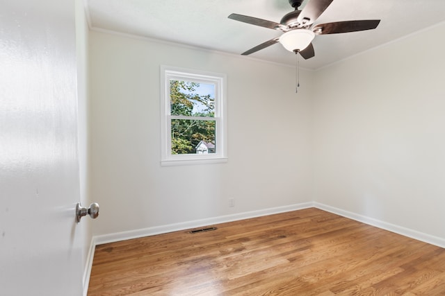 unfurnished room with light wood-type flooring, ceiling fan, and crown molding