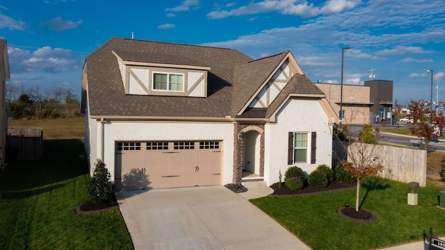 view of front facade featuring a garage and a front lawn