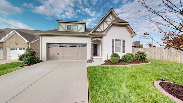 view of front of home featuring a garage and a front lawn