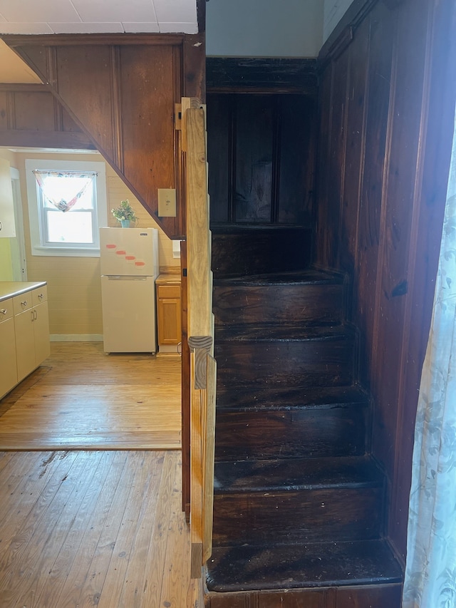 stairway featuring hardwood / wood-style floors