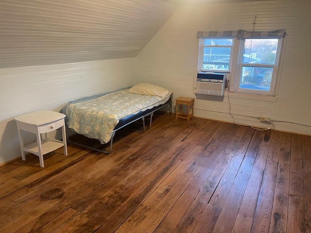 bedroom with wood-type flooring, vaulted ceiling, and cooling unit