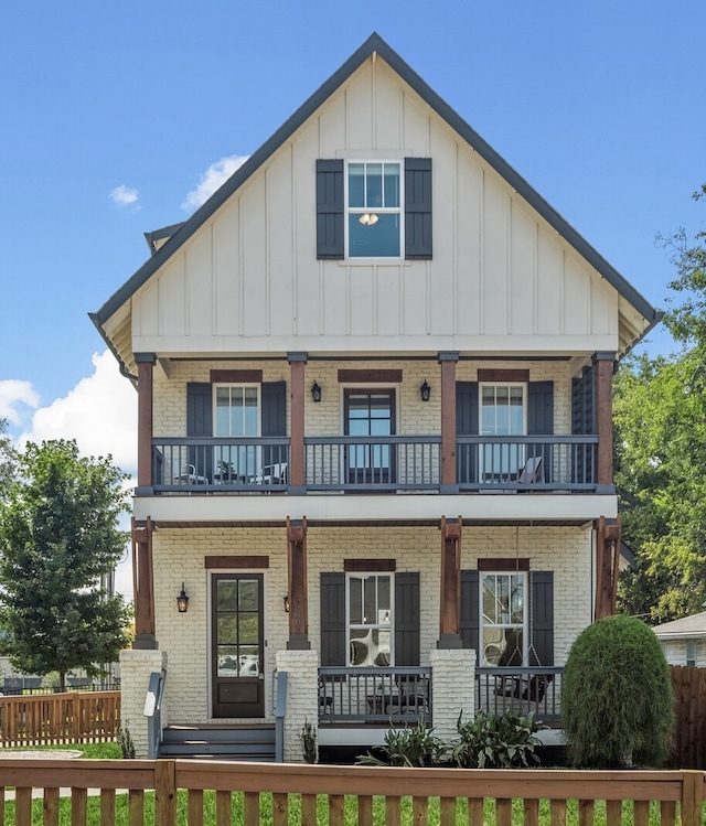 view of front of house with covered porch and a balcony