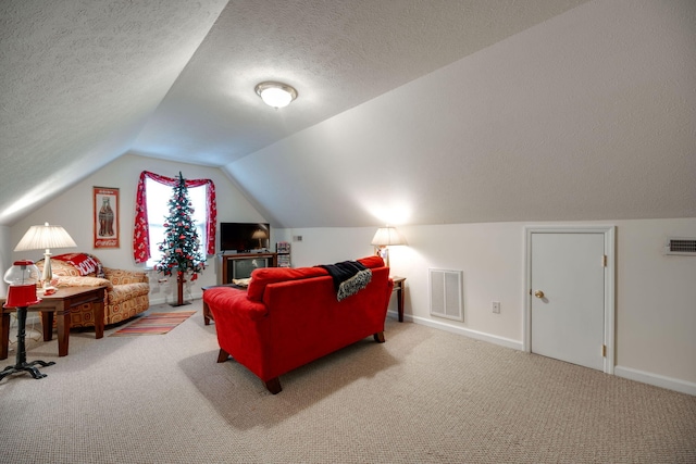 living room with carpet, a textured ceiling, and vaulted ceiling