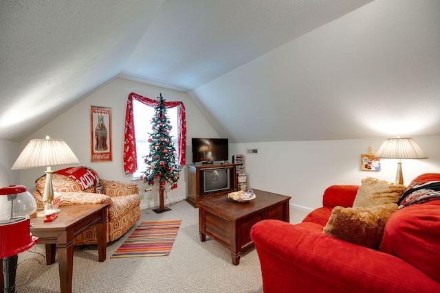 carpeted living room with vaulted ceiling