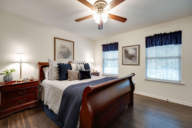 bedroom with ceiling fan and dark hardwood / wood-style flooring