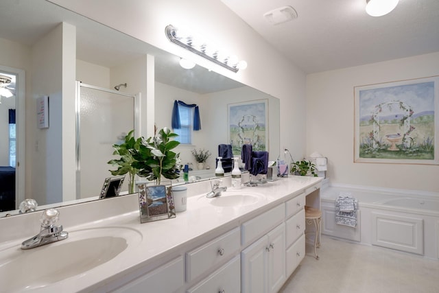 bathroom with vanity and independent shower and bath