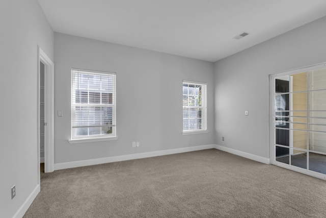 spare room featuring carpet floors