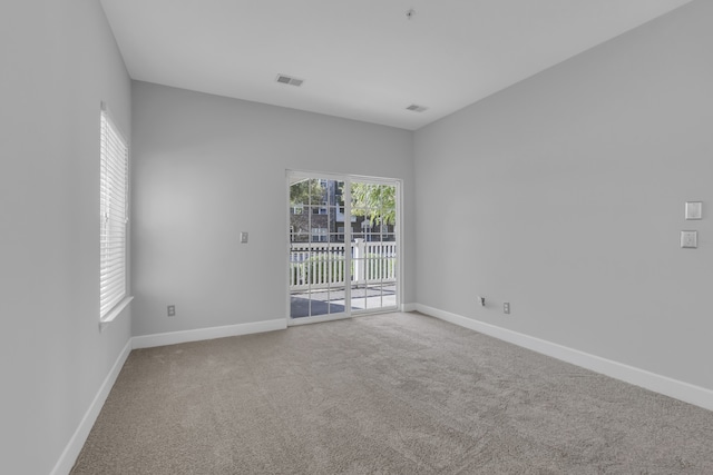 unfurnished room featuring carpet flooring