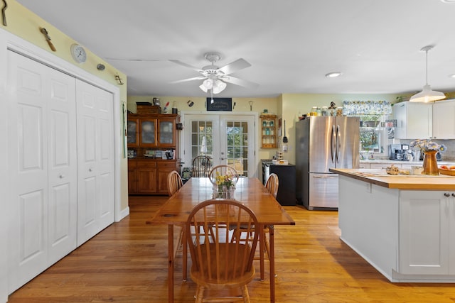 dining room featuring ceiling fan and light hardwood / wood-style floors