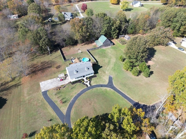 birds eye view of property with a rural view