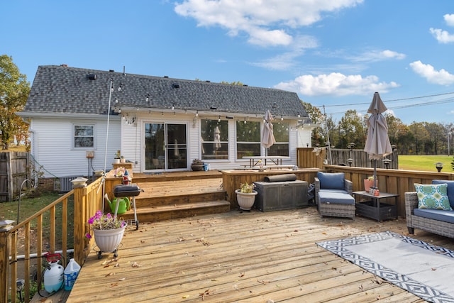 wooden terrace featuring a jacuzzi