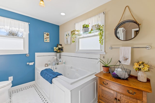 bathroom with a bathing tub and toilet